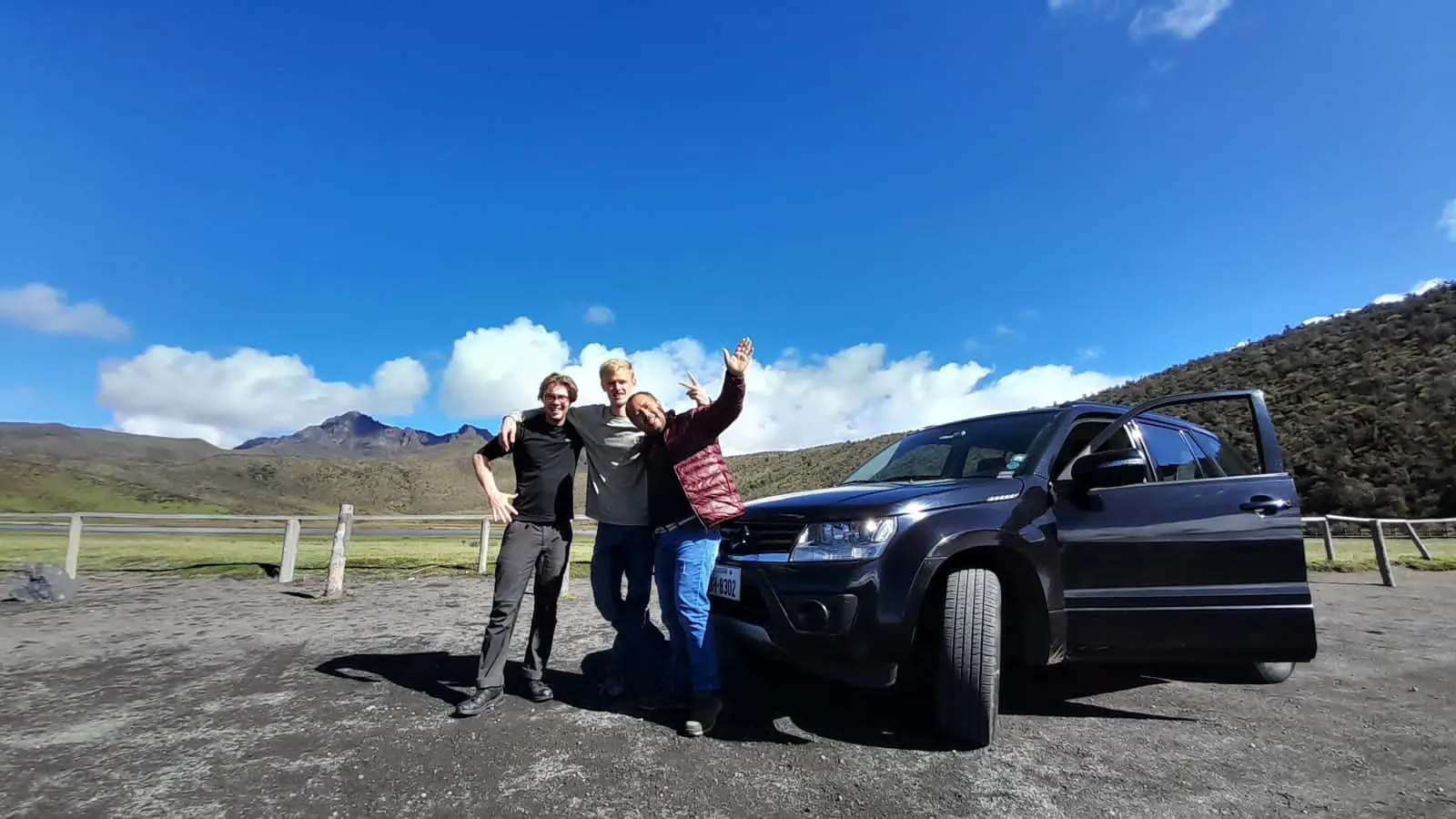 Tour guide and tourists in front of Cotopaxi National Park, Ecuador